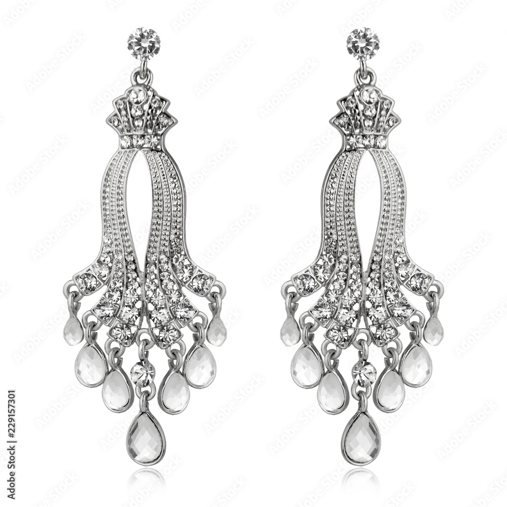 Pair of silver diamond earrings isolated on white Pair of silver diamond earrings isolated on white