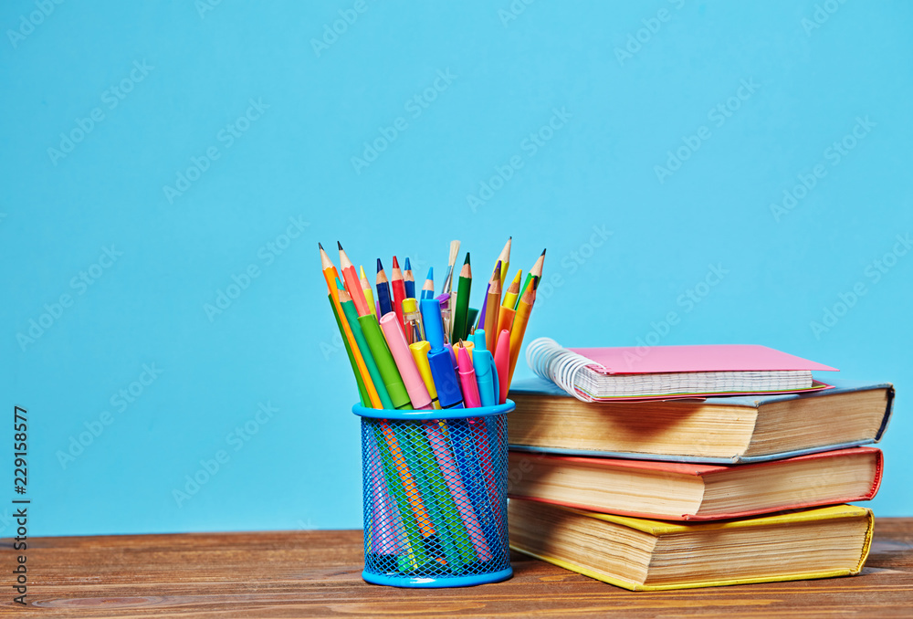 Fototapeta premium Education concept. Colored pencils near the books.