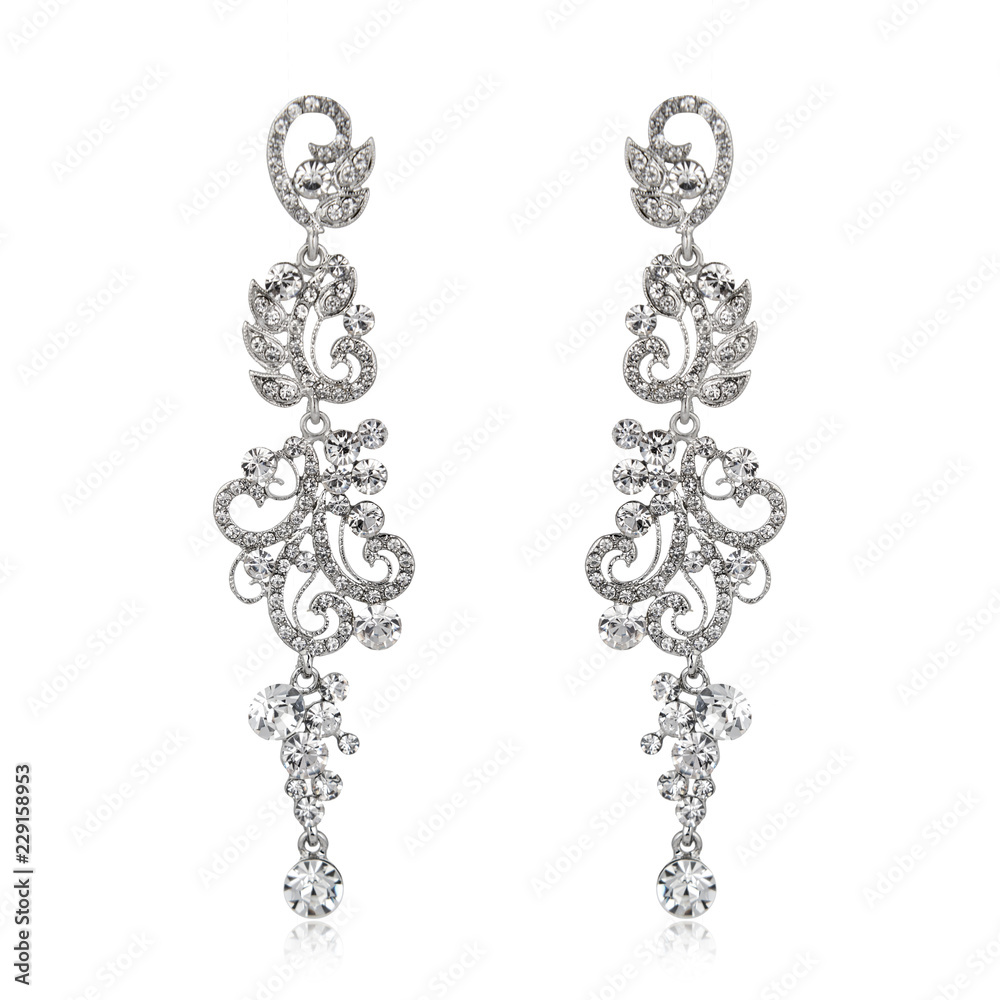 Pair of silver diamond earrings isolated on white Pair of silver diamond earrings isolated on white