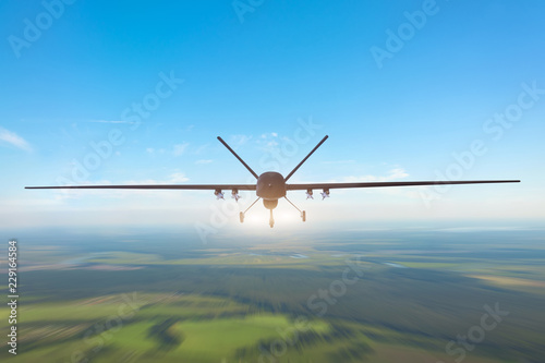 Unmanned military drone patrols the territory, flying over the terrain. The view is straight ahead.