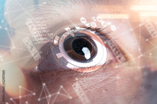 The double exposure image of the businessman's eye overlay with futuristic hologram. The concept of modern life, futuristic, technology, iris scanner and internet of things.