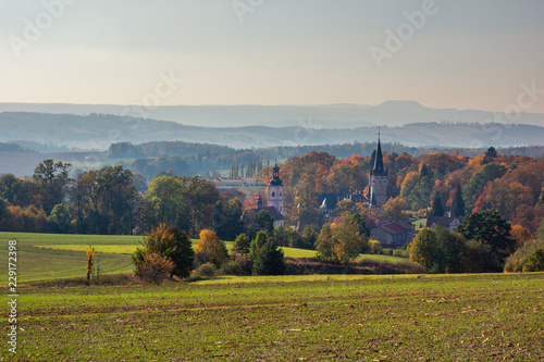 Palace and church in Bozkow near Stolowe mountains at autumn, Lower Silesia, Poland photo