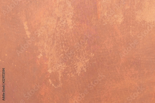 The texture of an orange natural poszarpane walls, metal old painted surface