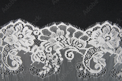 white floral lace on a black background