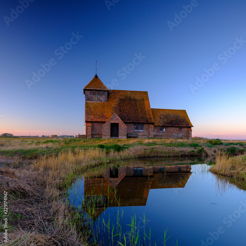 Autumnal clear evening sunset over St Thomas a Becket Church, Fairfield, in the Romney Marsh, Kent, UK