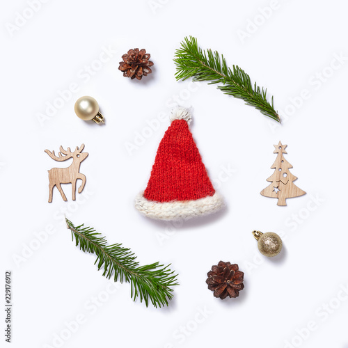 Christmas decorations and fir tree branches on white background. Flat lay.