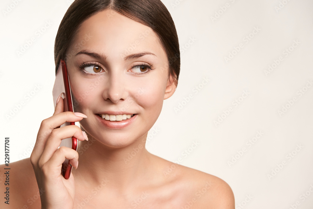 Young woman talk phone. Beautiful female laughing Young woman talk phone. Beautiful female laughing