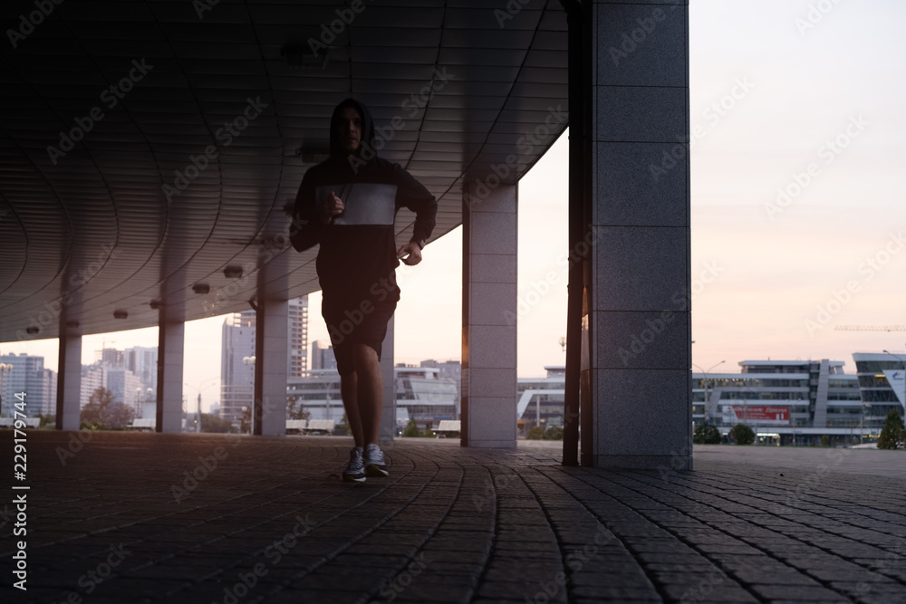 Fototapeta premium Fit athlete running outdoors to stay healthy