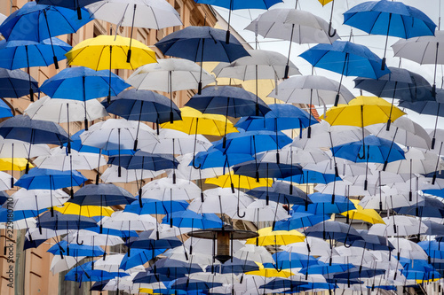 Umbrellas hanging in the city center of Brno in Czech Republic photo