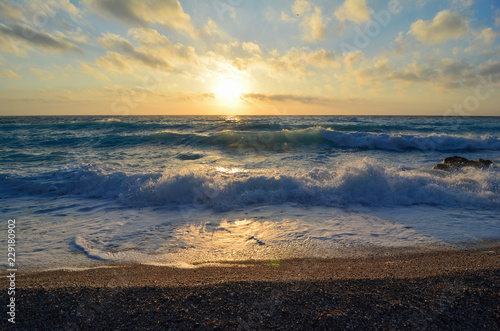 Fototapeta Naklejka Na Ścianę i Meble -  Sunset on a windy Ionian beach