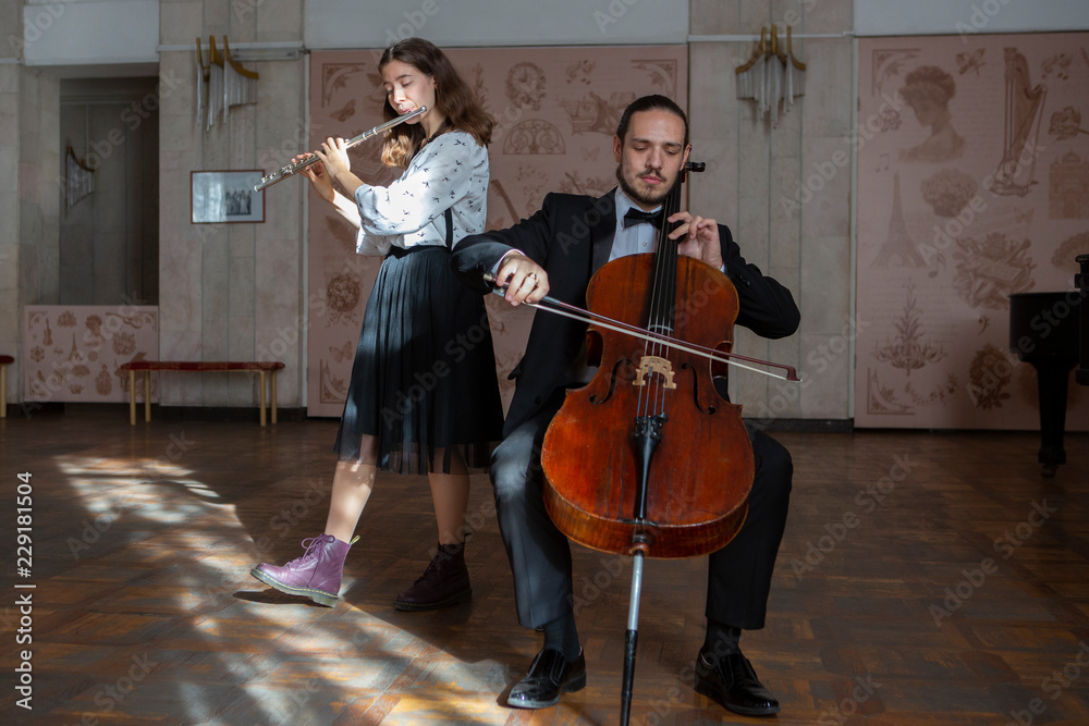 Fototapeta premium Young musicians of the symphony orchestra Duet