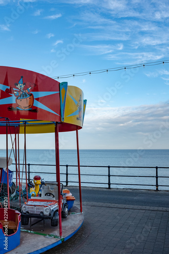 Merry go round on coastal seafront amusements