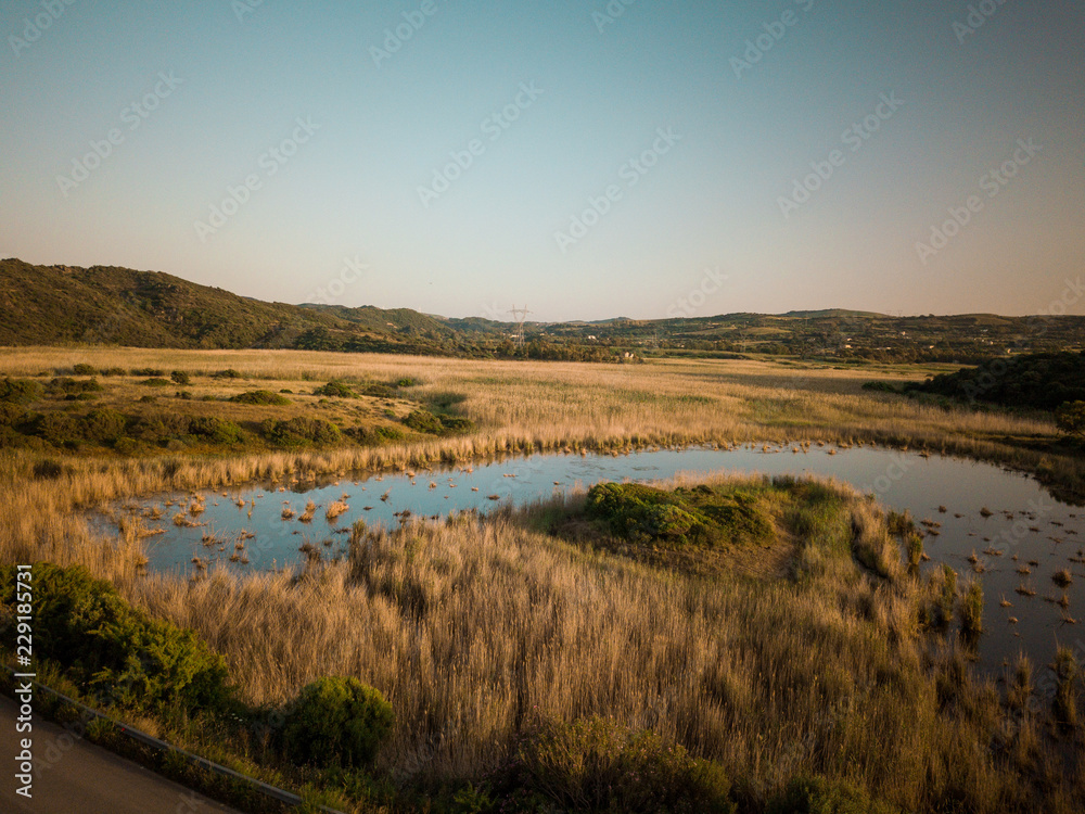 sunset on the lake in the countryside. Sardinia, Italy.