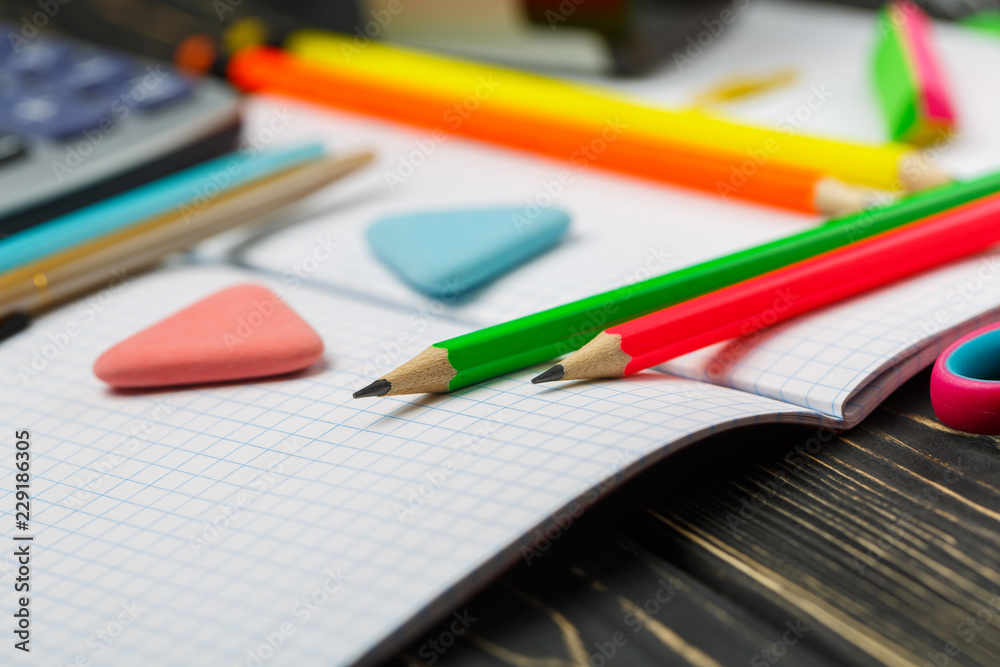 Bright items for a school on a wooden table Bright items for a school on a wooden table