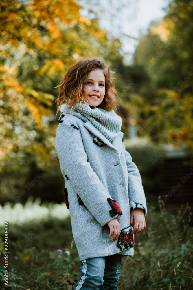 Beautiful and cheerful child. Beautiful autumn walk Beautiful and cheerful child. Beautiful autumn walk