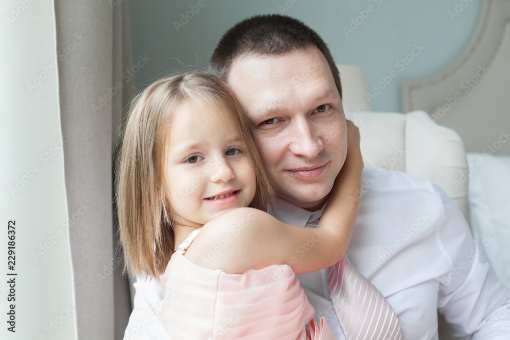 Father and daughter cuddling at home Father and daughter cuddling at home