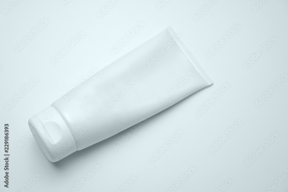 White Cosmetic Tube Pack Of Cream, Gel Or Lotion On The Light Background. Minimal Style Flat Lay With Space For Text. Branding Mock-up Concept Of Beauty Product White Cosmetic Tube Pack Of Cream, Gel Or Lotion On The Light Background. Minimal Style Flat Lay With Space For Text. Branding Mock-up Concept Of Beauty Product