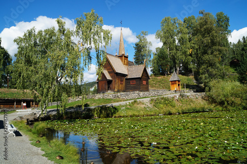 Old stave church on the side of a lake