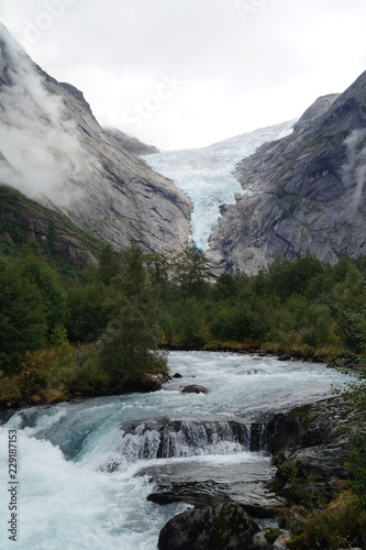 Waterfall and Briskdalsbreen glacier in Norway