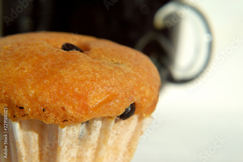 Muffin with cup of coffee Shallow depth of field photo