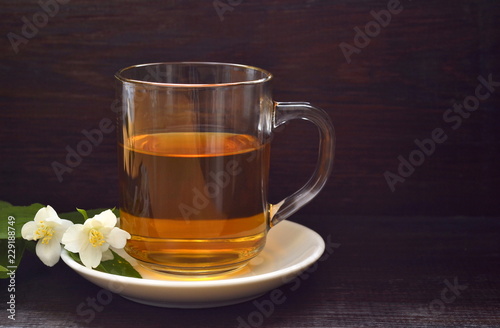 Green tea with jasmine blossom, copy space