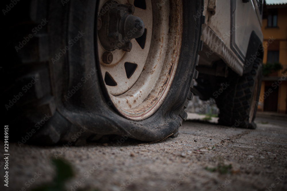deflated wheel, laundry wheel. Old jeep 4x4. deflated wheel, laundry wheel. Old jeep 4x4.