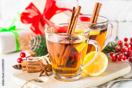 Winter hot tea with lemon and spices