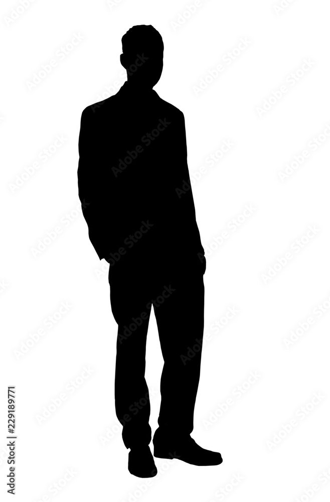 Silhouette of young man in a suit standing with hand in pocket