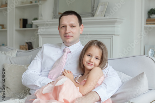 Father and daughter at home, portrait