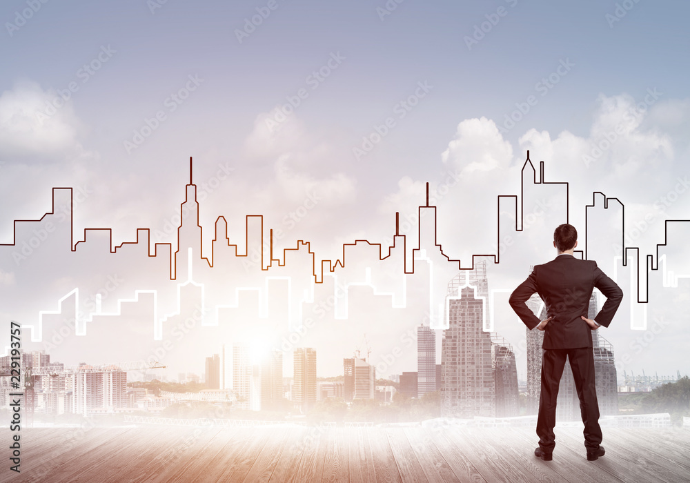 Motivation and inspiration concept with modern cityscape and businessman observing it Motivation and inspiration concept with modern cityscape and businessman observing it