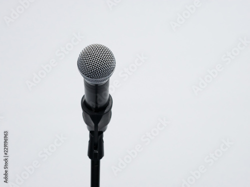 Wireless microphone on stand at white background