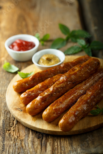 Homemade fried sausages with sauces