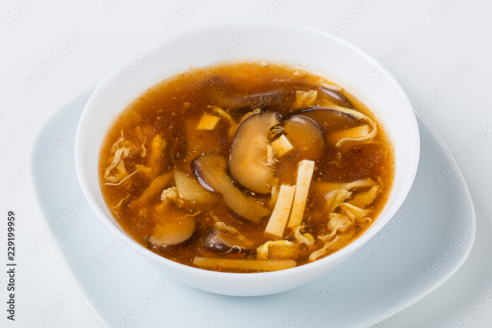 one hot soup in the white bowl with mushrooms and bamboo one hot soup in the white bowl with mushrooms and bamboo