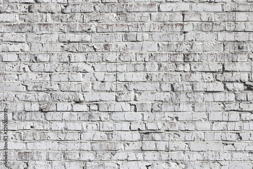 Old wall made of red brick, painted white in loft style for modern designer interior of room, bar or restaurant Old wall made of red brick, painted white in loft style for modern designer interior of room, bar or restaurant