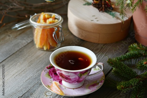Delicious Hot Cup of tea with christmas tree. Copy space. Christmas Background. Tea Time. Selective focus.