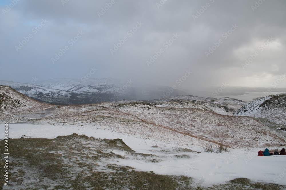 Winter in the Langdale Valley, English Lake District with cloud and snow covered fells