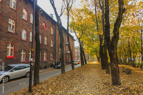 Street in Historic Mining District of Nikiszowiec in Katowice in Polish Silesia. On the left red-brick houses in which the miner's family lived
