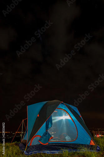 Tent and background sky and mountain views at night.