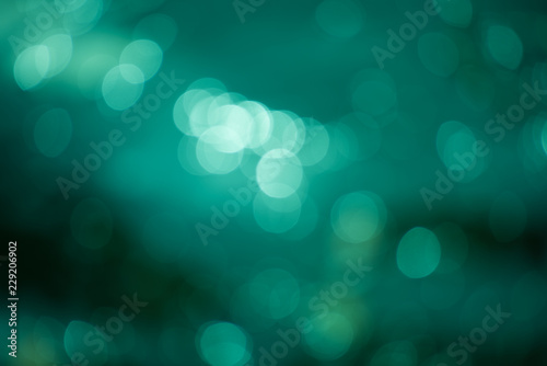 Abstract blurred emerald background with round bokeh, photo