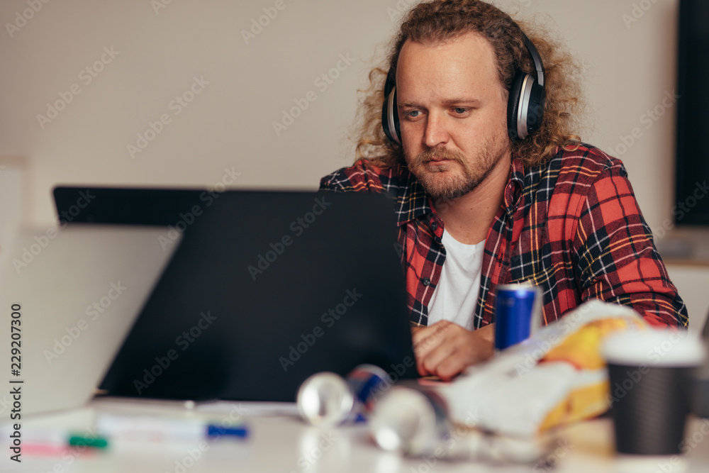 Man busy coding on laptop t tech startup Man busy coding on laptop t tech startup