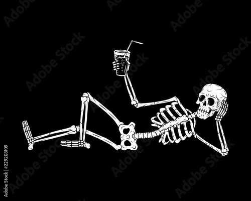 RESTING SKELETON WITH COCKTAIL BLACK BACKGROUND photo