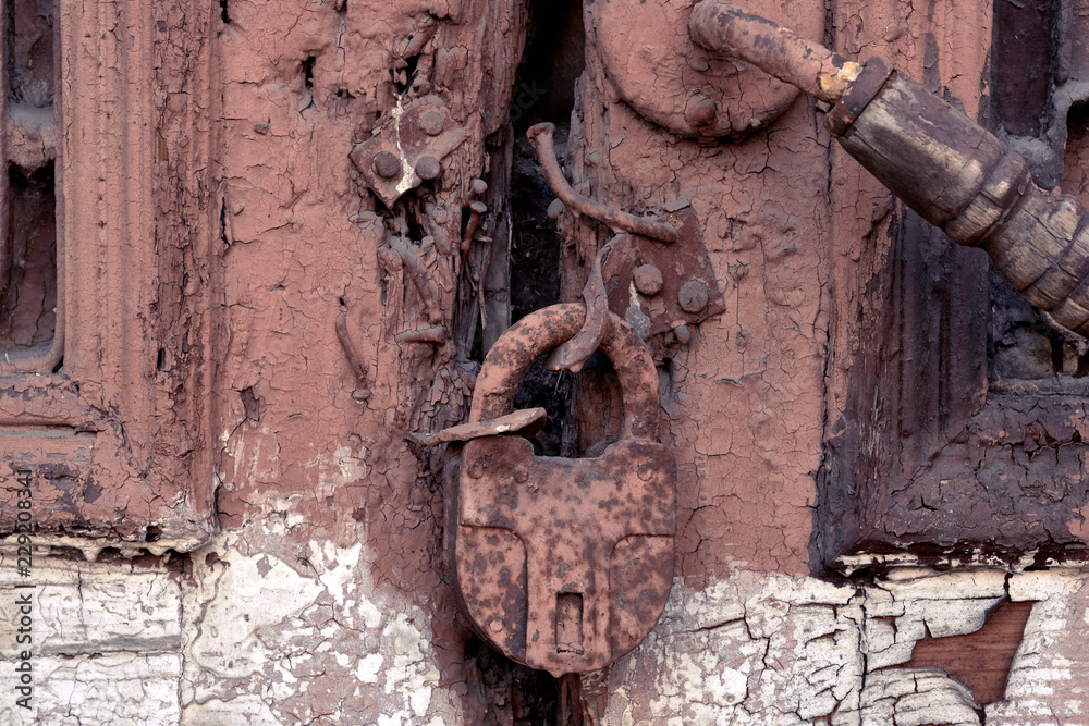Old rusty padlock on the door