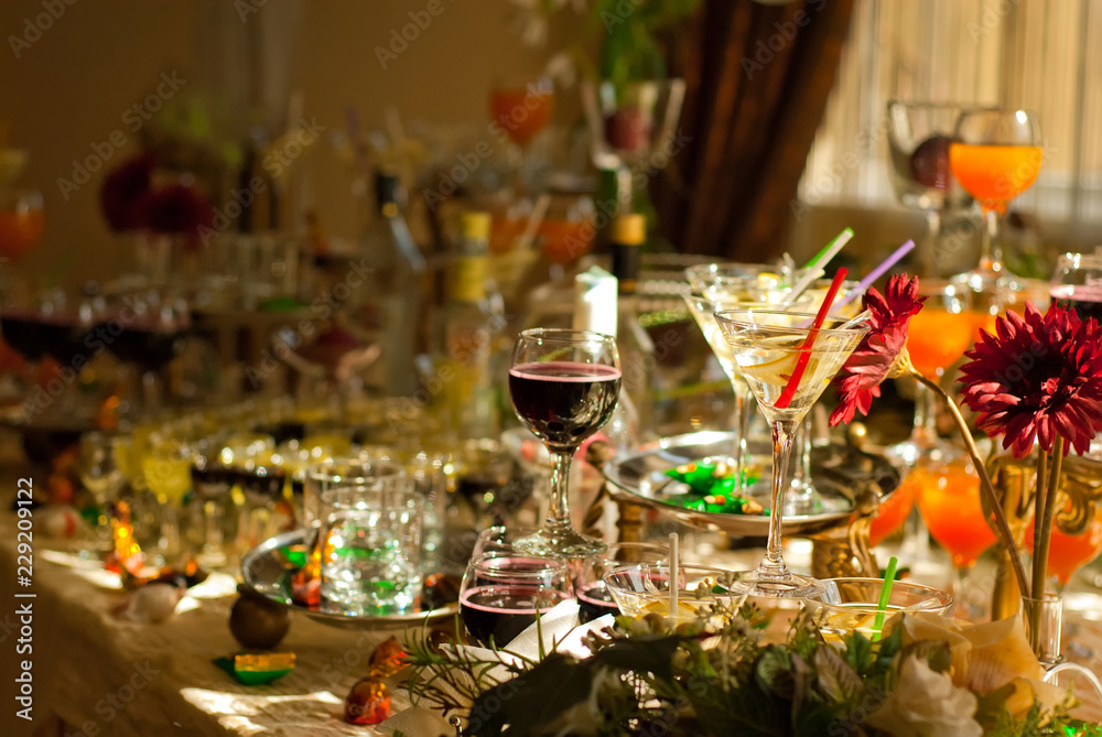 Glass glasses with colored drinks on the table. alcoholic drinks at the buffet