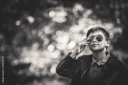 Boy in Maverick Pilot costume and aviator sunglasses