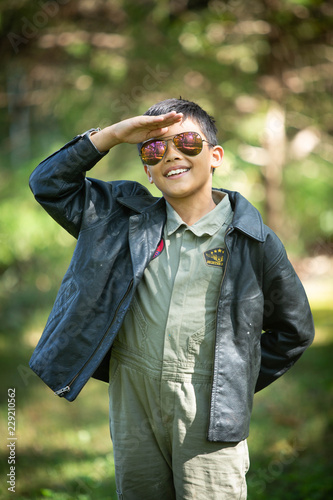 Boy in Maverick Pilot costume and aviator sunglasses