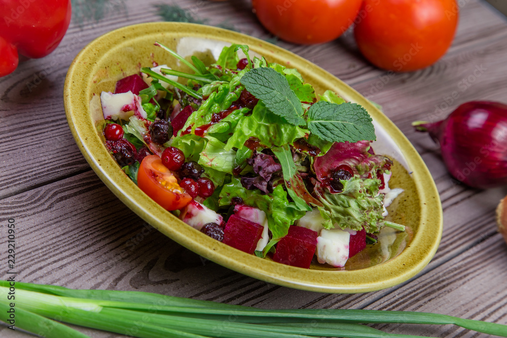 Fresh green salad mix with berries and mint Fresh green salad mix with berries and mint