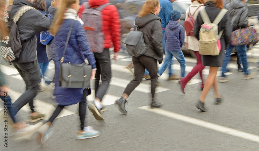 People cross the road.