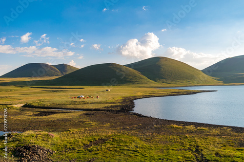 Lake Akna with volcanos in background, Geghama mountains, Armenia