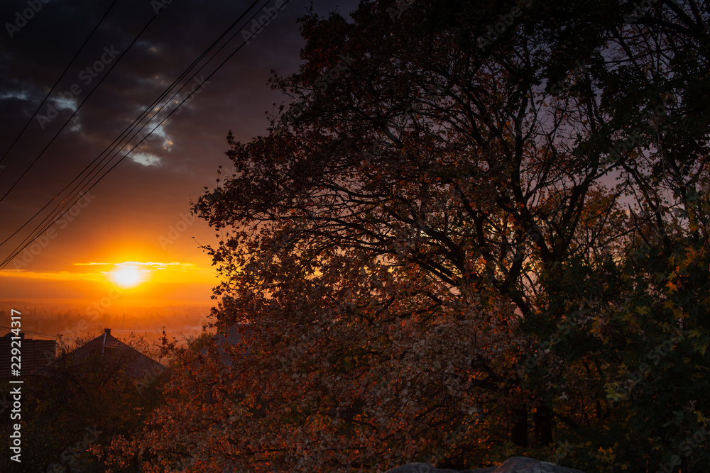Orange sun, sharp clouds from an autumn sunset. Orange sun, sharp clouds from an autumn sunset.