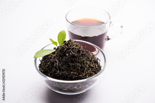 Black Tea Powder or dry dust with or without green leaf and served hot chai in a cup